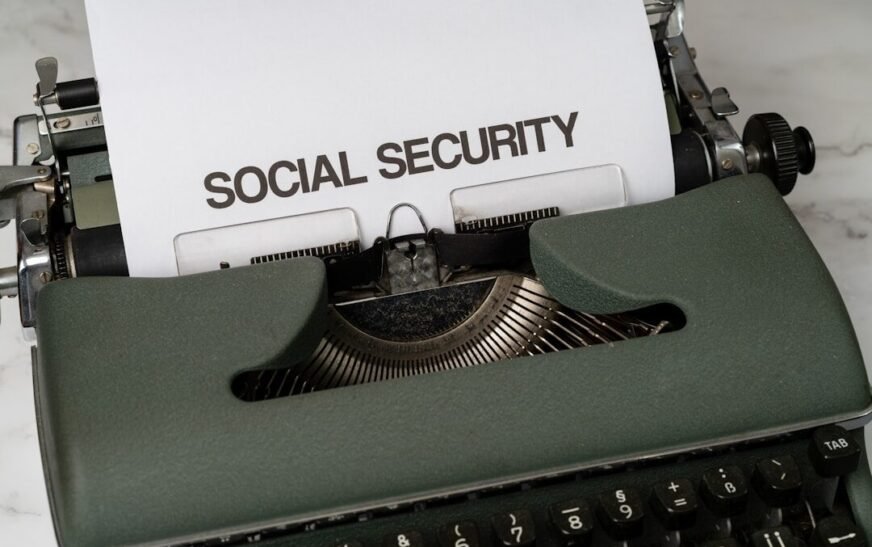 a close up of a typewriter with a paper that says social security