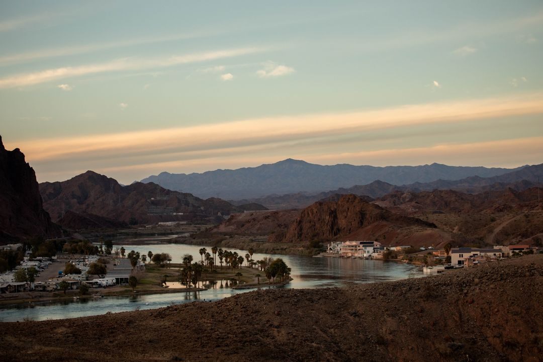 Stunning view of the Parker Arizona river surrounded by mountains and sunset skies.