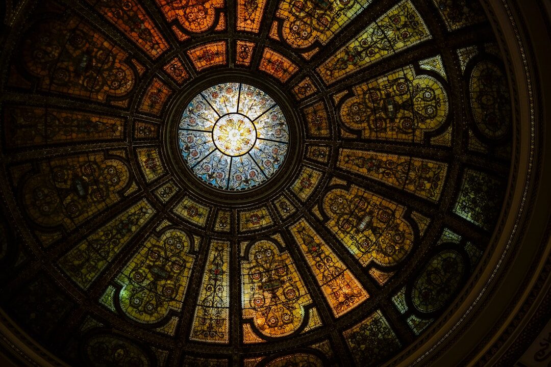 a circular stained glass window in a building